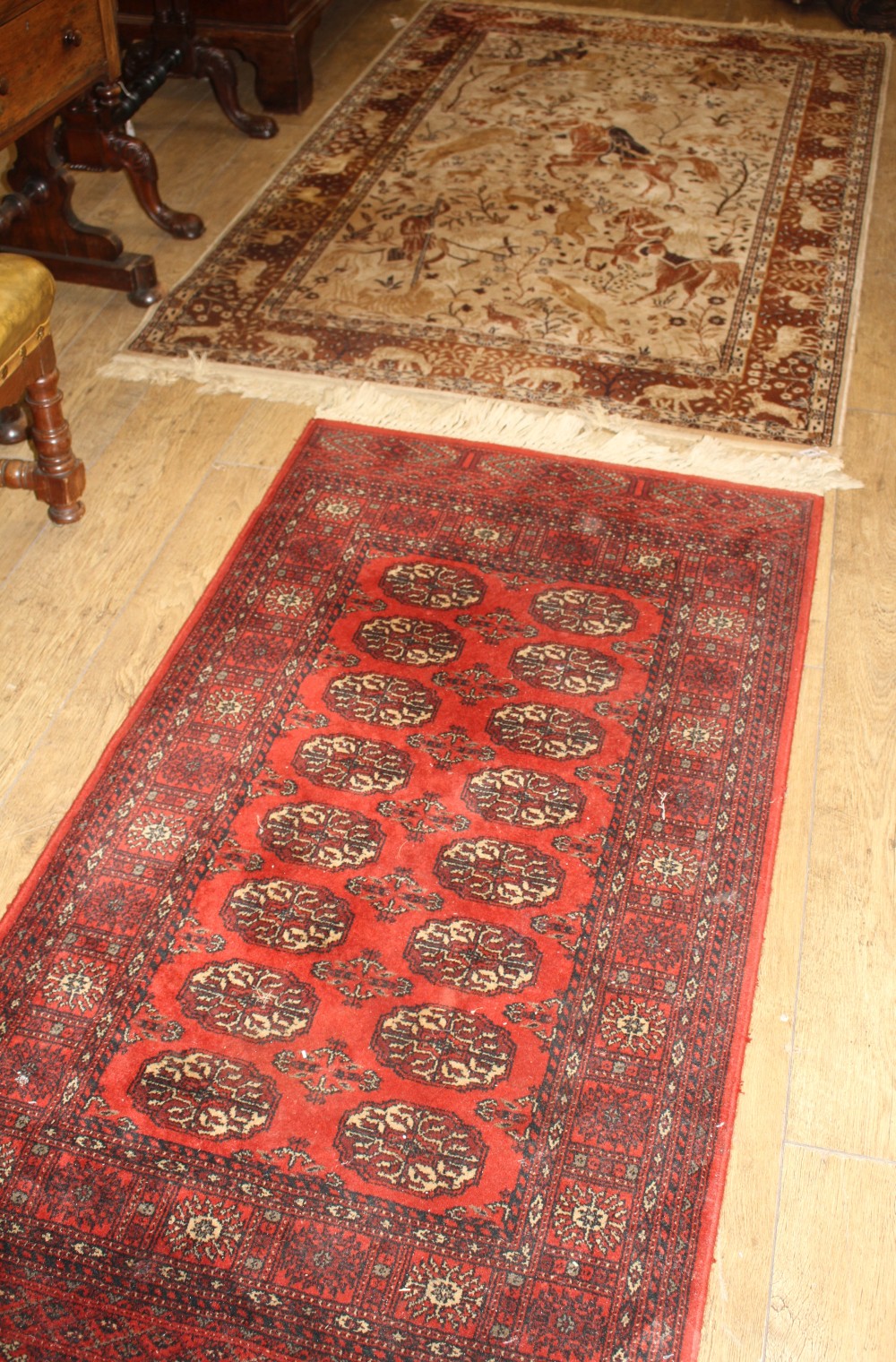 A Meshed machined wool rug, 190 x 126cm and a Bokhara machined rug, 170 x 83cm